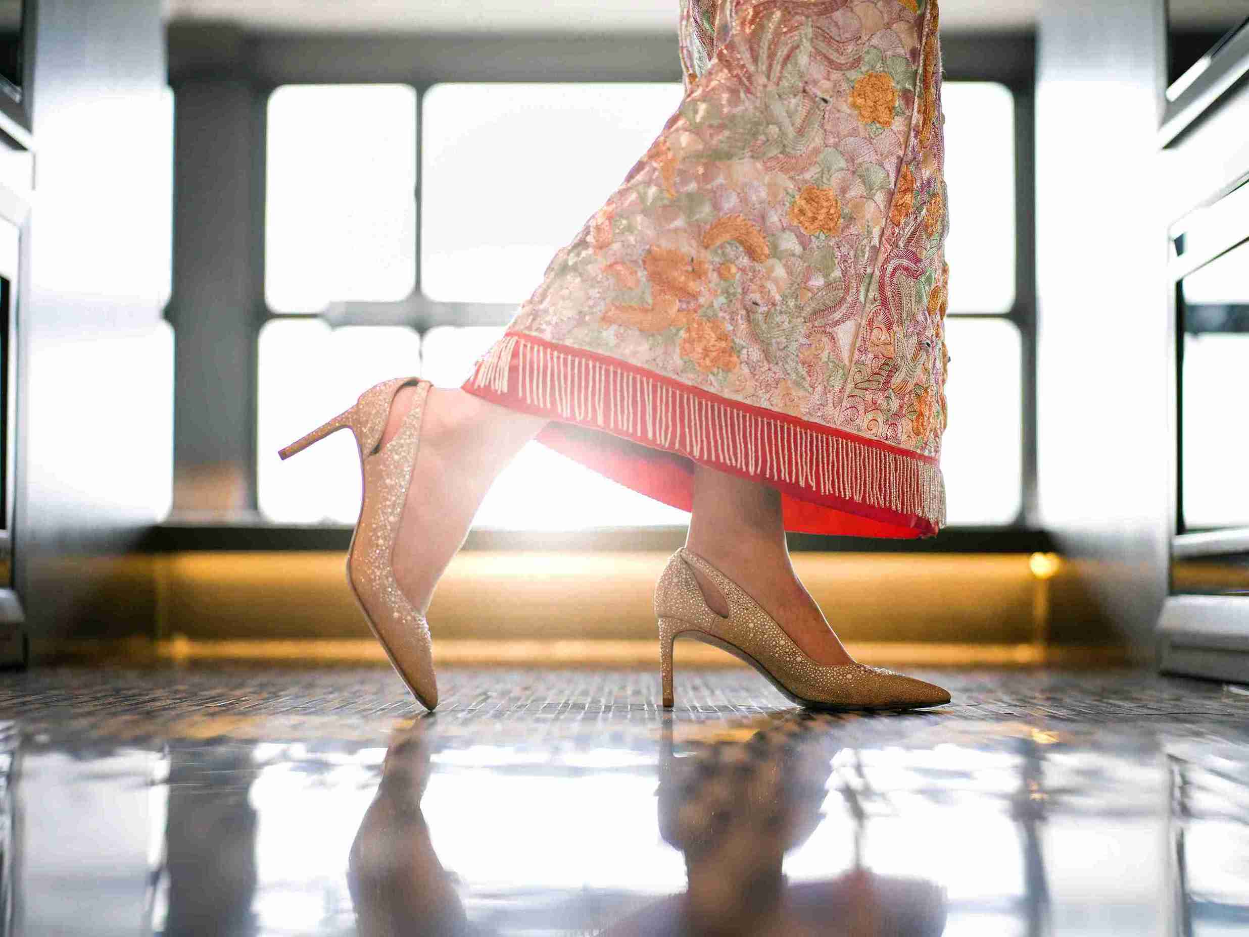 Park Lane Wedding Suite Package Picture of Bride wearing golden heels with Chinese Wedding Gown